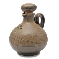 Hand-potted brown holy water jug